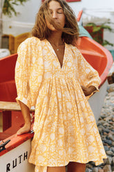 Take Your Joy – Bedrucktes Babydoll-Minikleid – Gelb