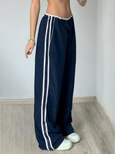 Lange Hose mit Reißverschluss und Kontrastbindung