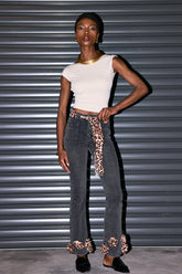 Schwarze Jeans mit Zopfmuster und Leopardenmuster