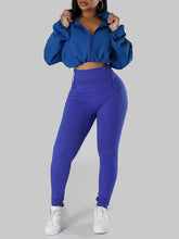 Set aus Oberteil und Hose mit Reißverschluss vorne