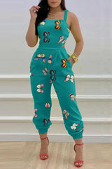 Libby – Rückenfreier Jumpsuit mit tropischem Muster und überkreuzten Schnürdetails