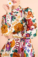 Palermo – Langärmliges Minikleid mit Blumendruck und Schnürung