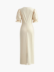 Langes Kleid mit Schlitz am Rücken und Puffärmeln